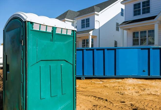 a row of porta potties at a construction site